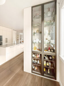 Floor to ceiling glass cabinets bronze frame — European kitchen Bellevue Washington State